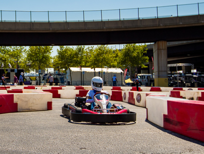 A go-cart course with driver in helmet.